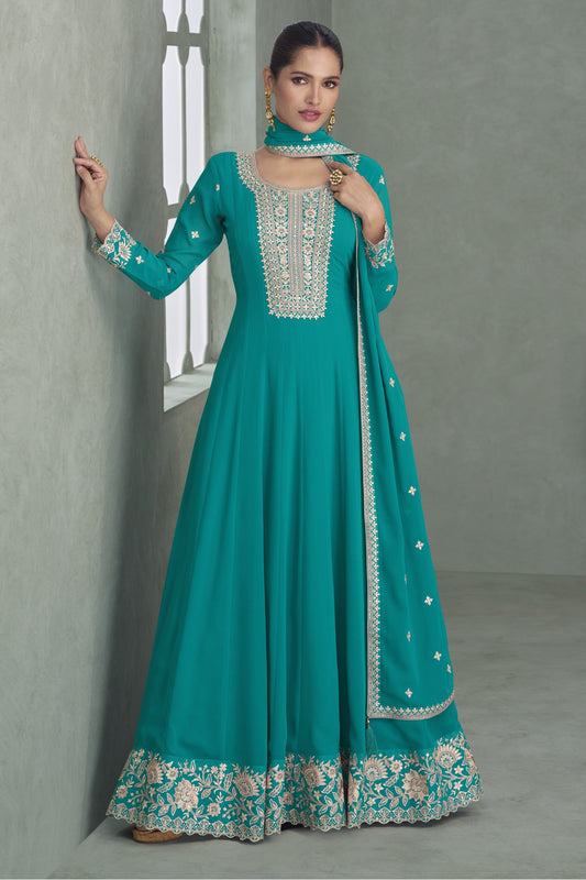 Teal blue color Anarkali gown in georgette fabric with sequin and embroidery work, blending vibrant sophistication with festive appeal.