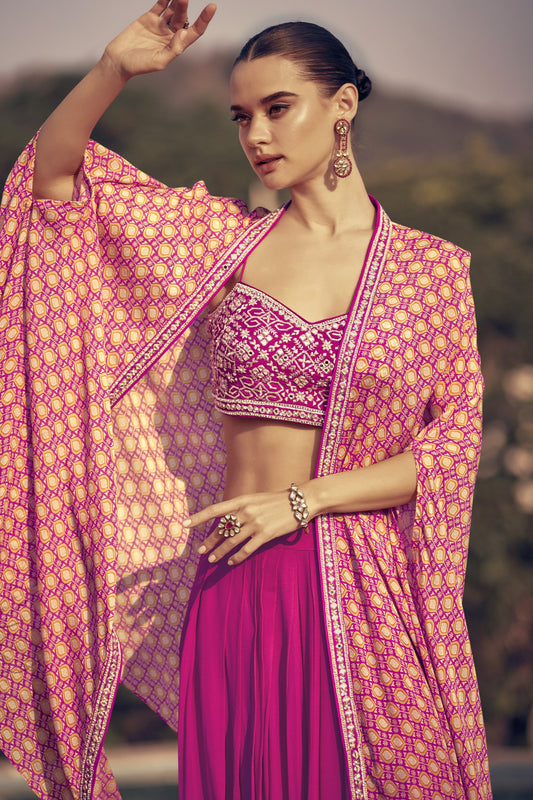 Dark pink color palazzo suit in premium Chinon silk fabric with elegant embroidery work, offering a bold and festive look for special occasions.