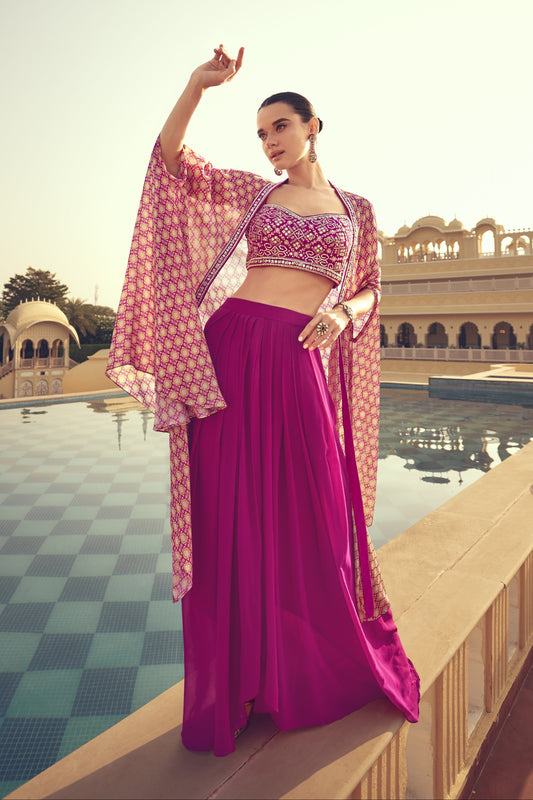 Dark pink color palazzo suit in premium Chinon silk fabric with elegant embroidery work, offering a bold and festive look for special occasions.