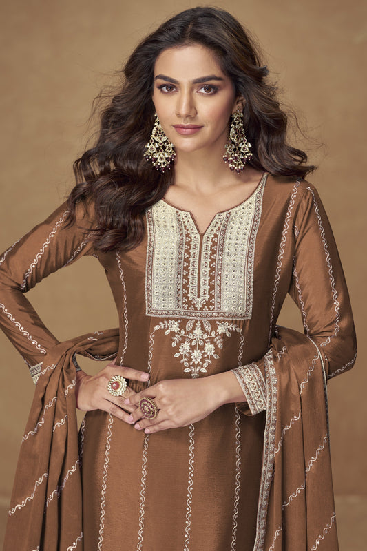 Brown color palazzo suit in Chinon silk fabric with embroidery work, showcasing warm tones and traditional charm for festive celebrations.
