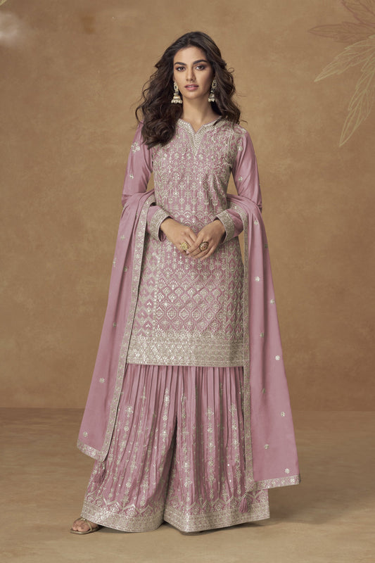 Rose gold color palazzo suit in Chinon fabric with embroidery work, combining soft shimmer with intricate detailing for a graceful festive appearance.