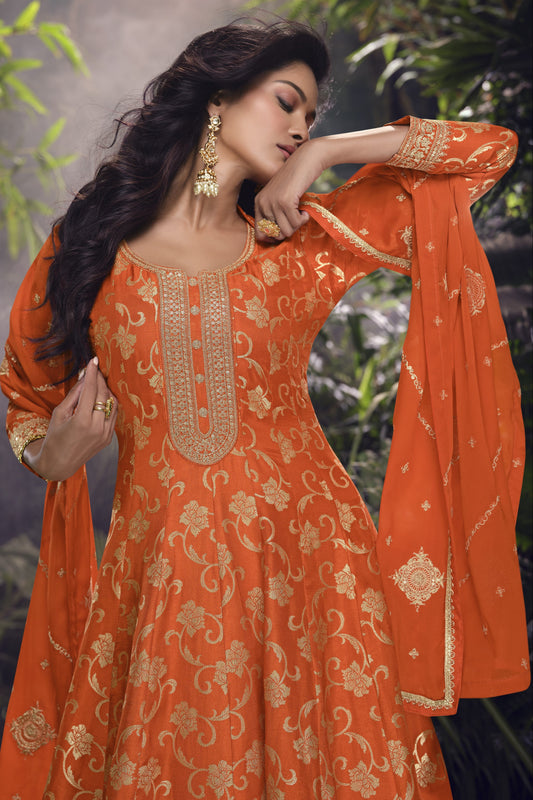 Orange color palazzo suit in viscose jacquard silk fabric with embroidery work, blending bright festive charm with traditional elegance.