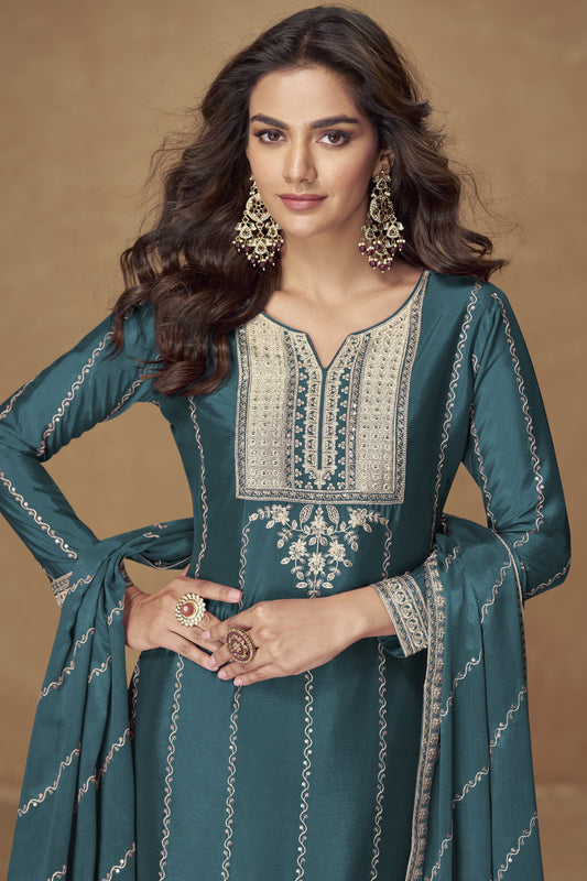 Teal blue color palazzo suit in Chinon silk fabric with embroidery work, combining vibrant color with elegant detailing for special occasions.