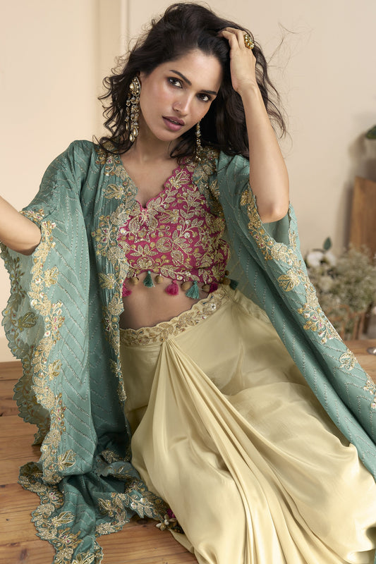 Beige color shrug lehenga in premium Chinon silk with heavy embroidery and hand embellished work, ideal for festive and wedding wear.