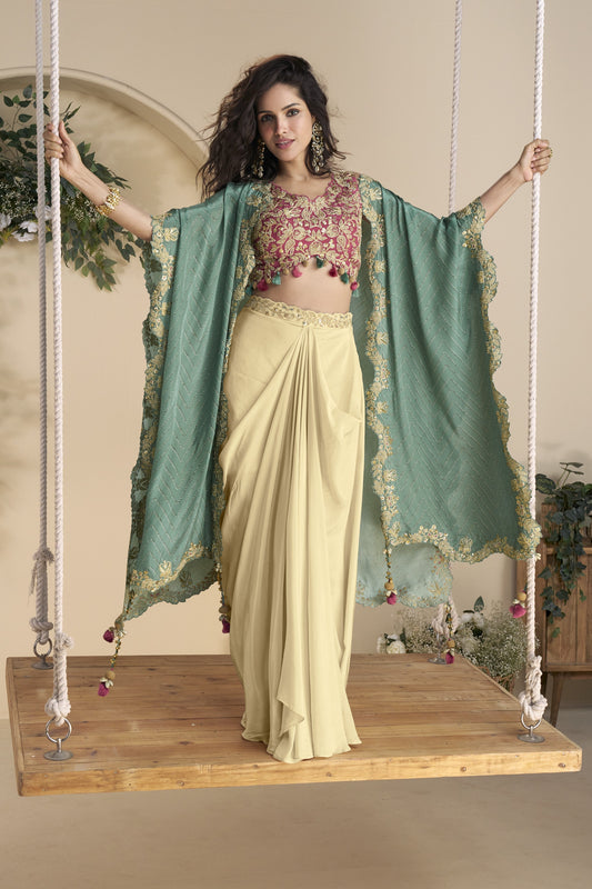 Beige color shrug lehenga in premium Chinon silk with heavy embroidery and hand embellished work, ideal for festive and wedding wear.