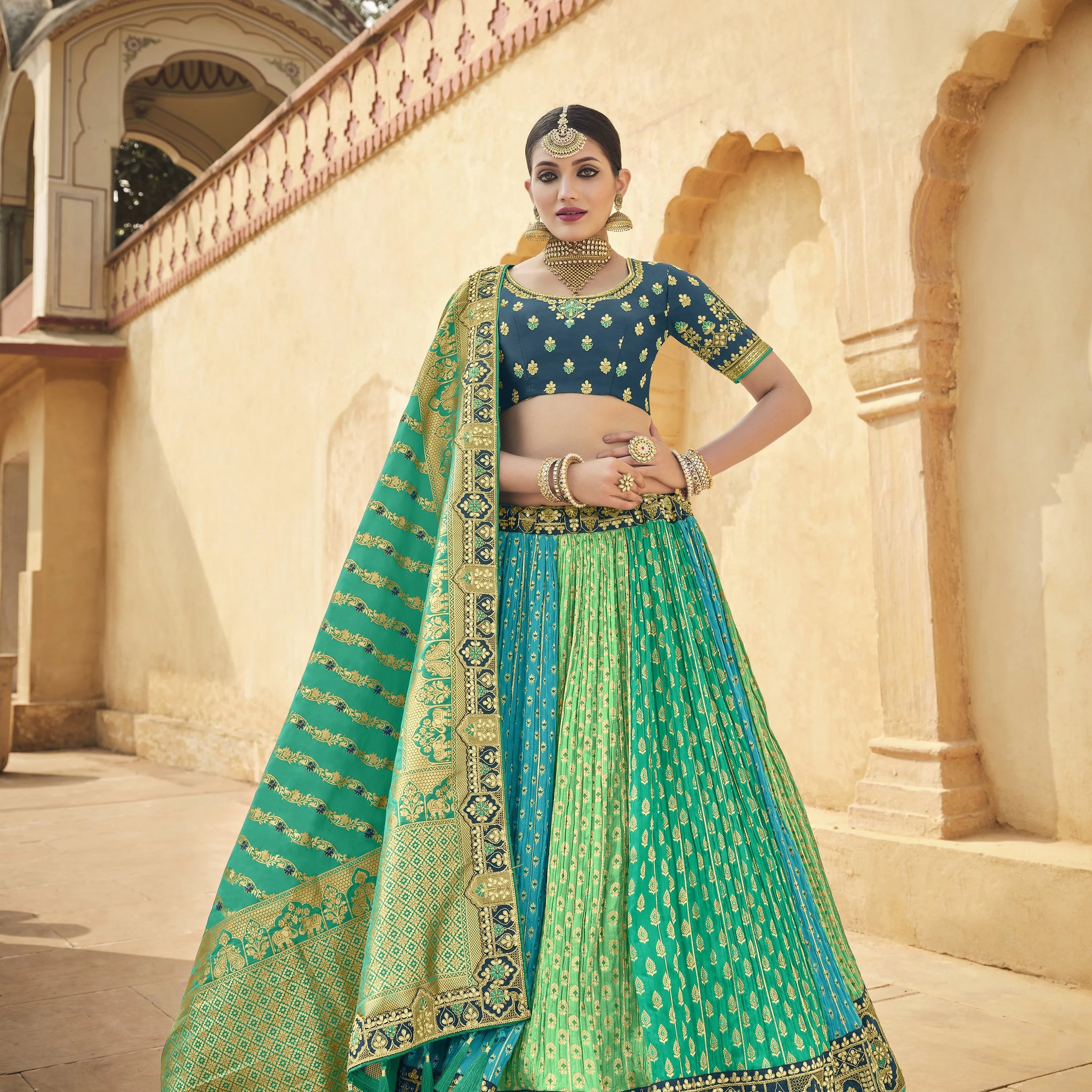 Tempiting Rama Pista Firozi Color Banarasi Silk Fabric Reception Wear Lehenga Choli