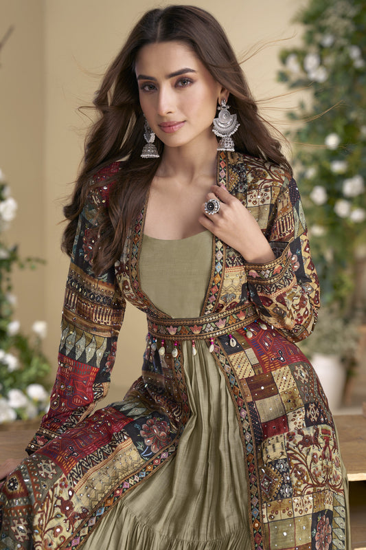 Sage green color Anarkali gown in georgette and silk fabric with embellished work, offering a soft yet regal look perfect for festive and formal events.
