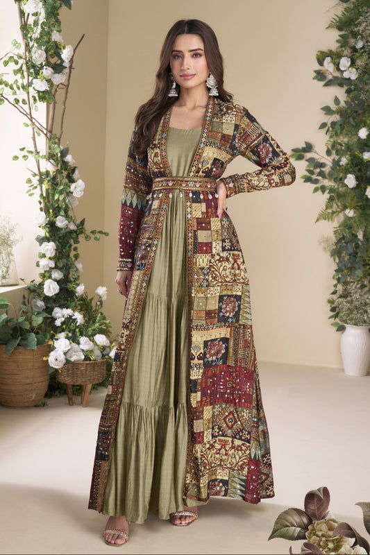 Sage green color Anarkali gown in georgette and silk fabric with embellished work, offering a soft yet regal look perfect for festive and formal events.
