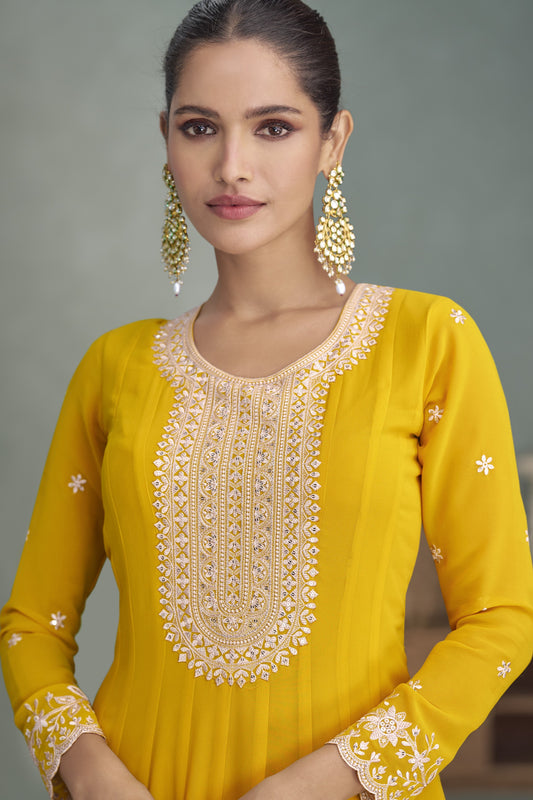 Yellow color Anarkali gown in georgette fabric with sequin and embroidery work, radiating bright elegance perfect for celebrations and festive events.