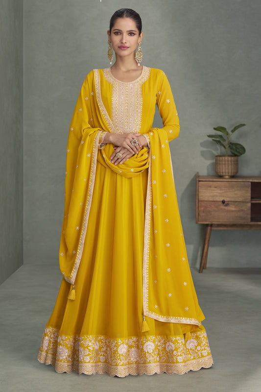 Yellow color Anarkali gown in georgette fabric with sequin and embroidery work, radiating bright elegance perfect for celebrations and festive events.