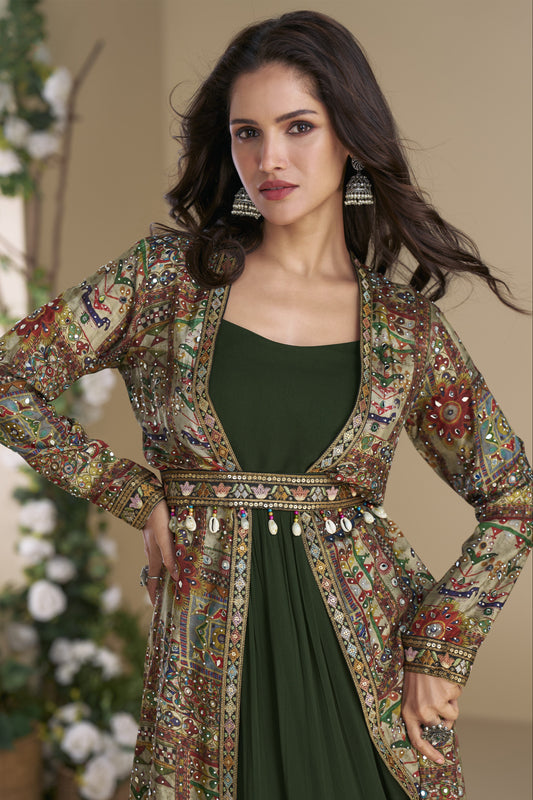 Dark green color Anarkali gown in georgette and silk fabric with embellished work, showcasing a rich and elegant look perfect for festive and wedding celebrations.
