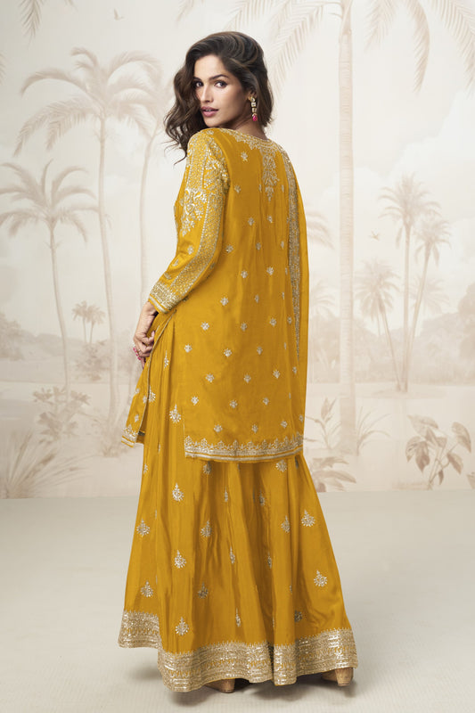 Yellow color palazzo suit in Chinon silk fabric with embroidery work, radiating bright festive energy with a traditional flair.

