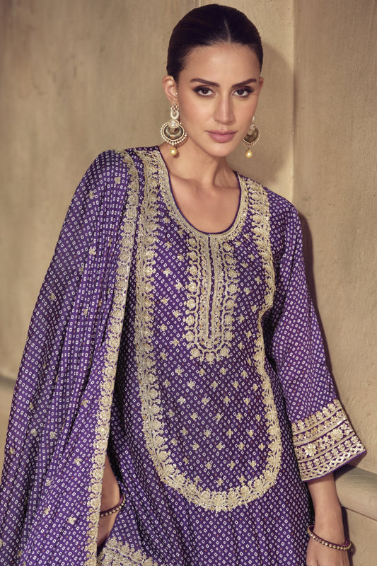 Purple color palazzo suit in Chinon fabric with embroidery work, offering a regal and graceful look perfect for festive occasions.
