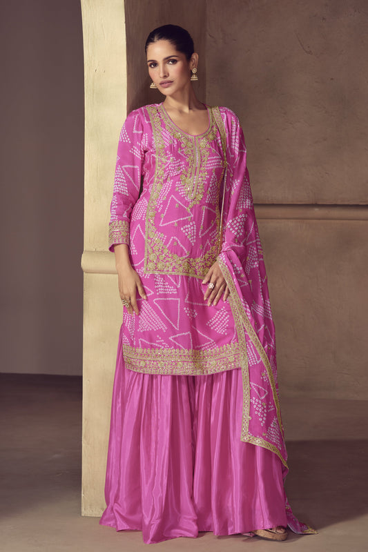 Pink color palazzo suit in Chinon fabric with embroidery work, showcasing a soft and elegant charm ideal for traditional events.

