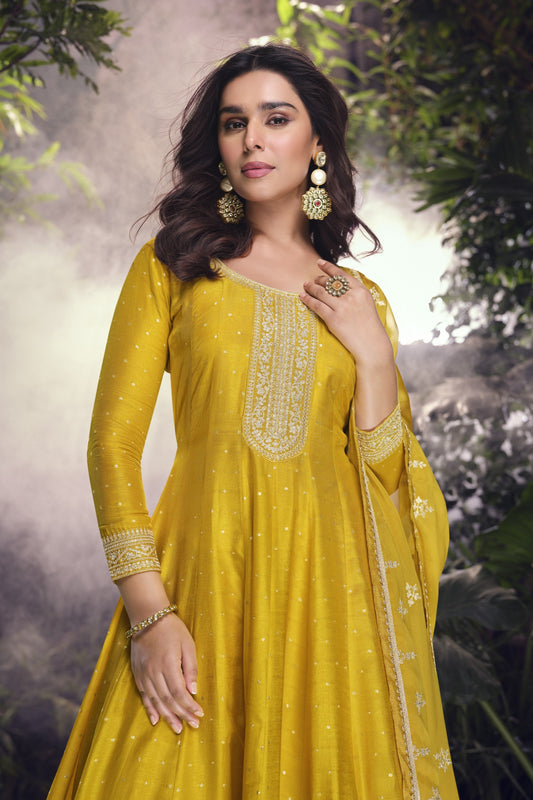 Yellow color palazzo suit in viscose jacquard silk fabric with embroidery work, radiating vibrant elegance perfect for festive and special occasions.
