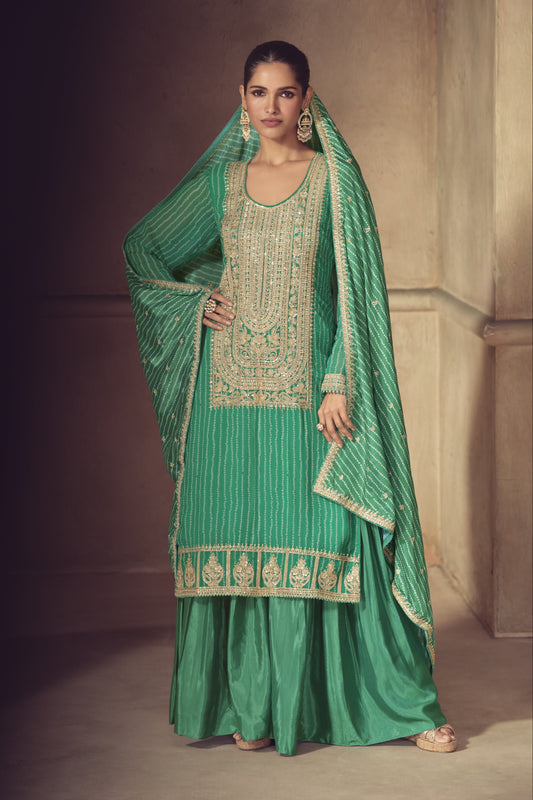 Green color palazzo suit in Chinon fabric with embroidery work, featuring fresh tones and classic detailing for a refined ethnic look.
