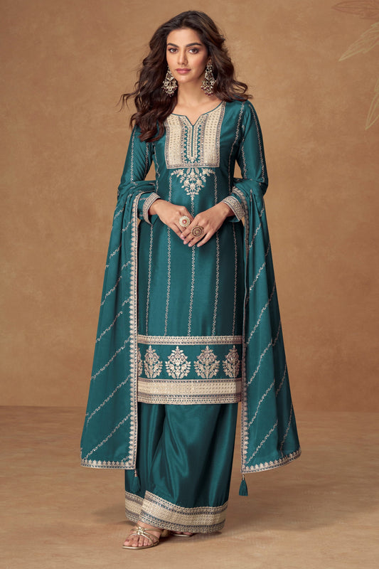 Teal blue color palazzo suit in Chinon silk fabric with embroidery work, combining vibrant color with elegant detailing for special occasions.

