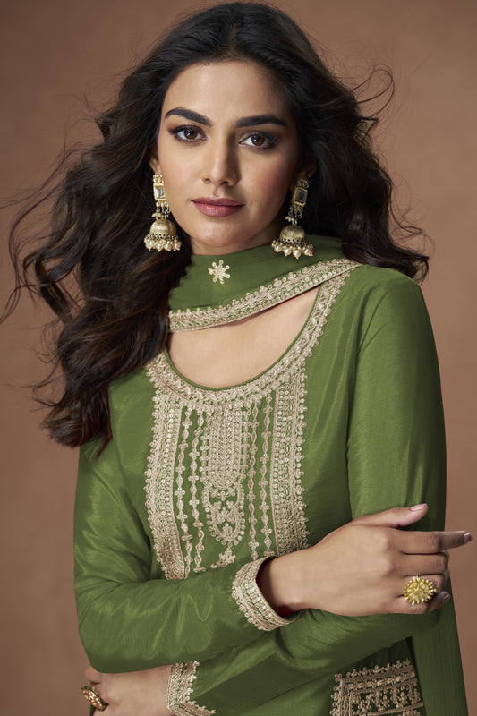 Green color palazzo suit in Chinon silk fabric with embroidery work, offering a fresh and elegant look ideal for festive wear.

