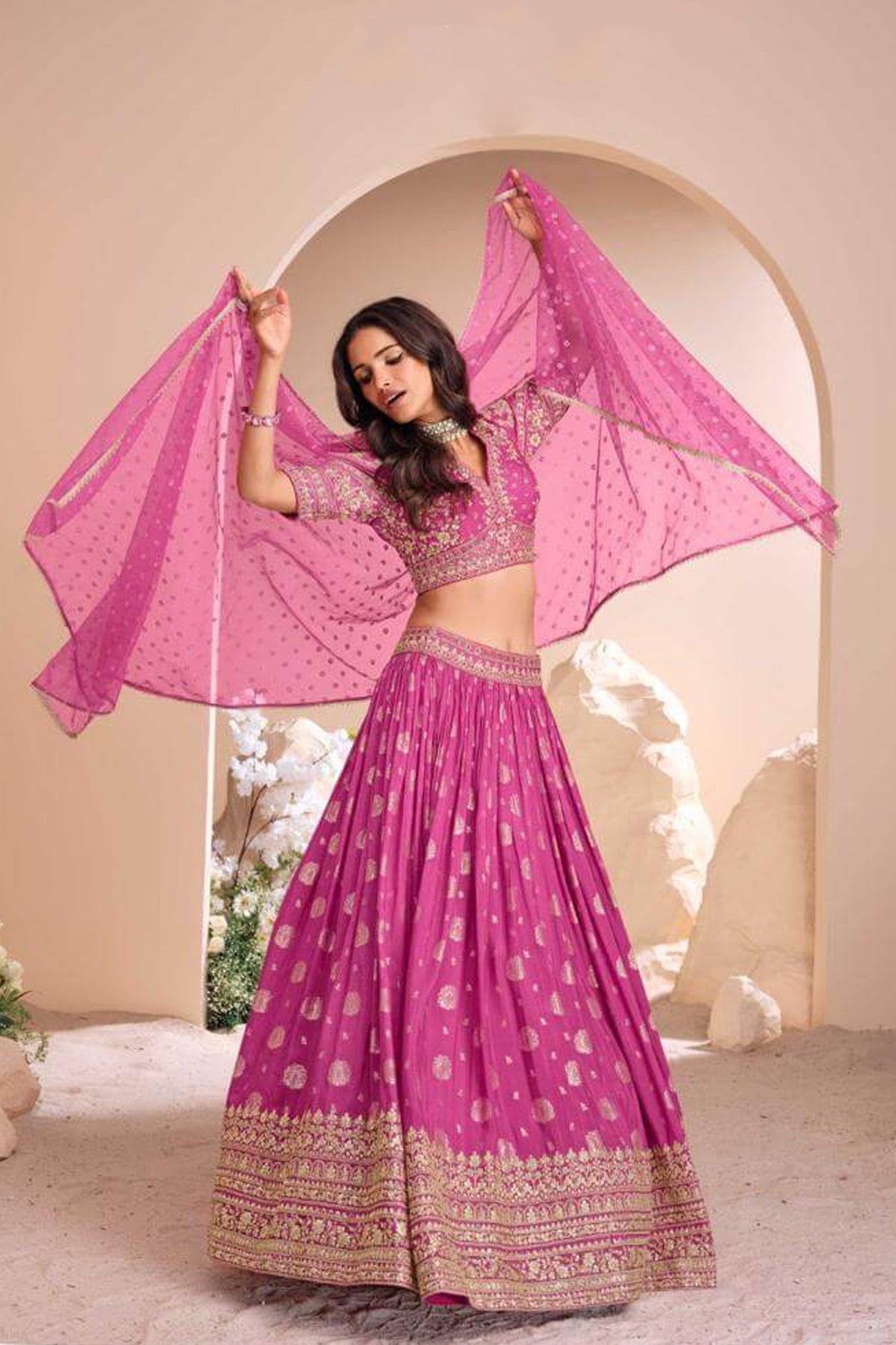 Pink designer lehenga choli blouse and heavy gold zari embroidery on neckline, bodice and short sleeves for women