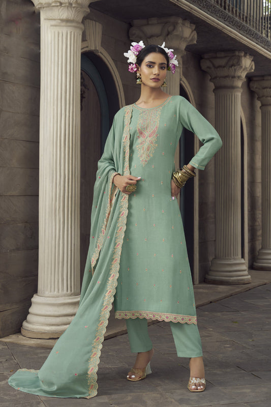 Green Salwar Kameez – perfect for Mehndi nights, family events, and joyful occasions.
