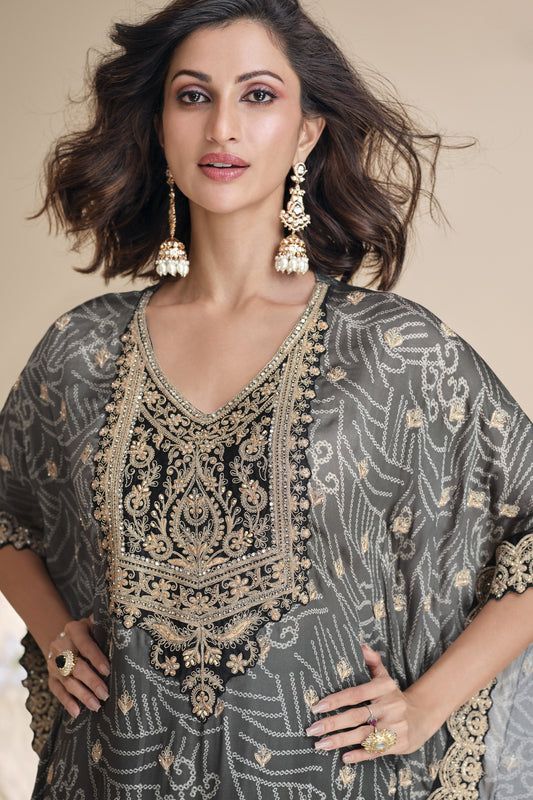 Black color palazzo suit in viscose silk, highlighted with intricate mirror and embellished work for a bold and sophisticated festive look.

