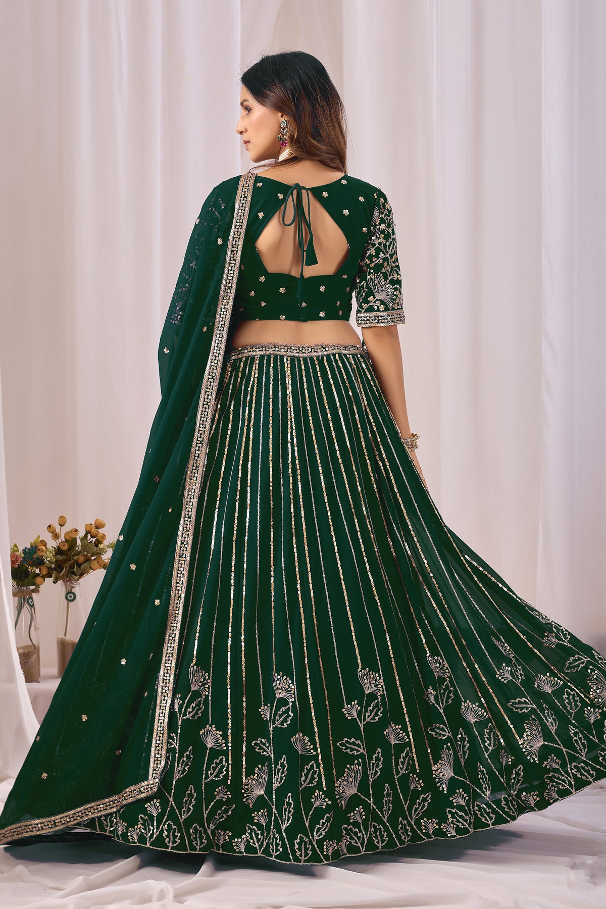 Back view of the green blouse, if shown in the image.