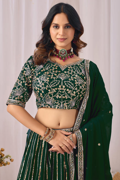 Front view of a green embroidered lehenga choli set.