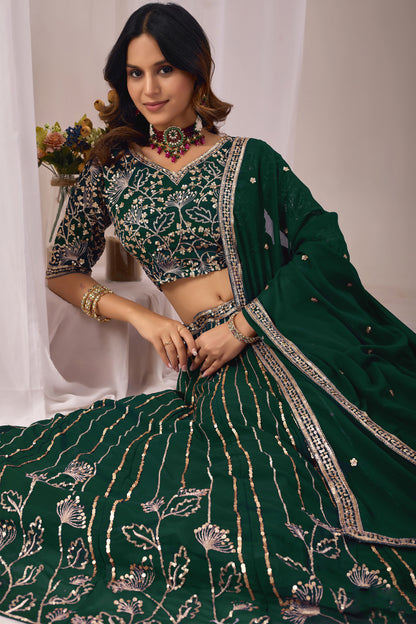 Close-up of embroidery and sequin work on the green lehenga.