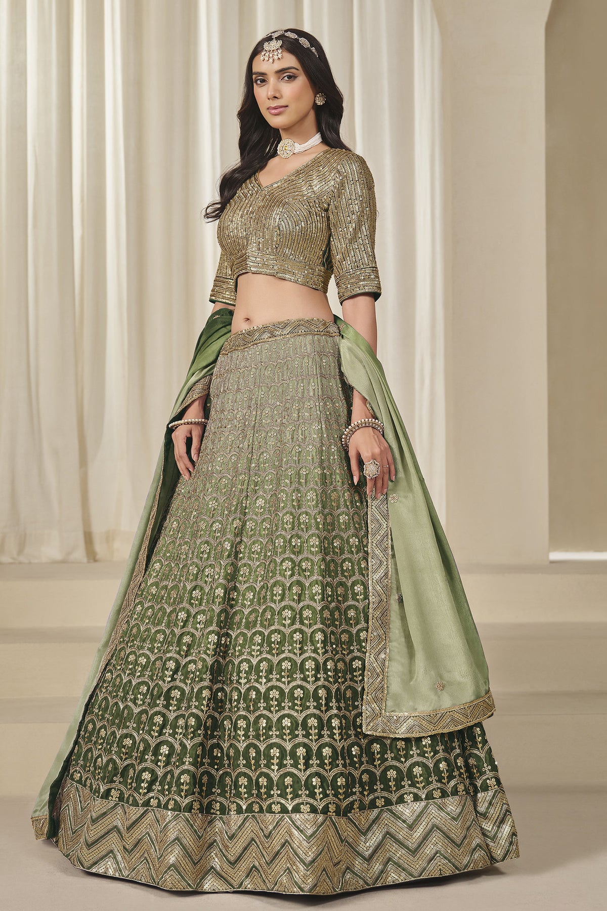 Green Chinon silk lehenga with detailed embroidered skirt border