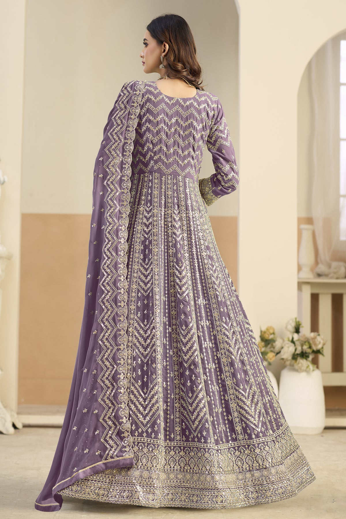 Back view of lavender anarkali gown with embroidered border