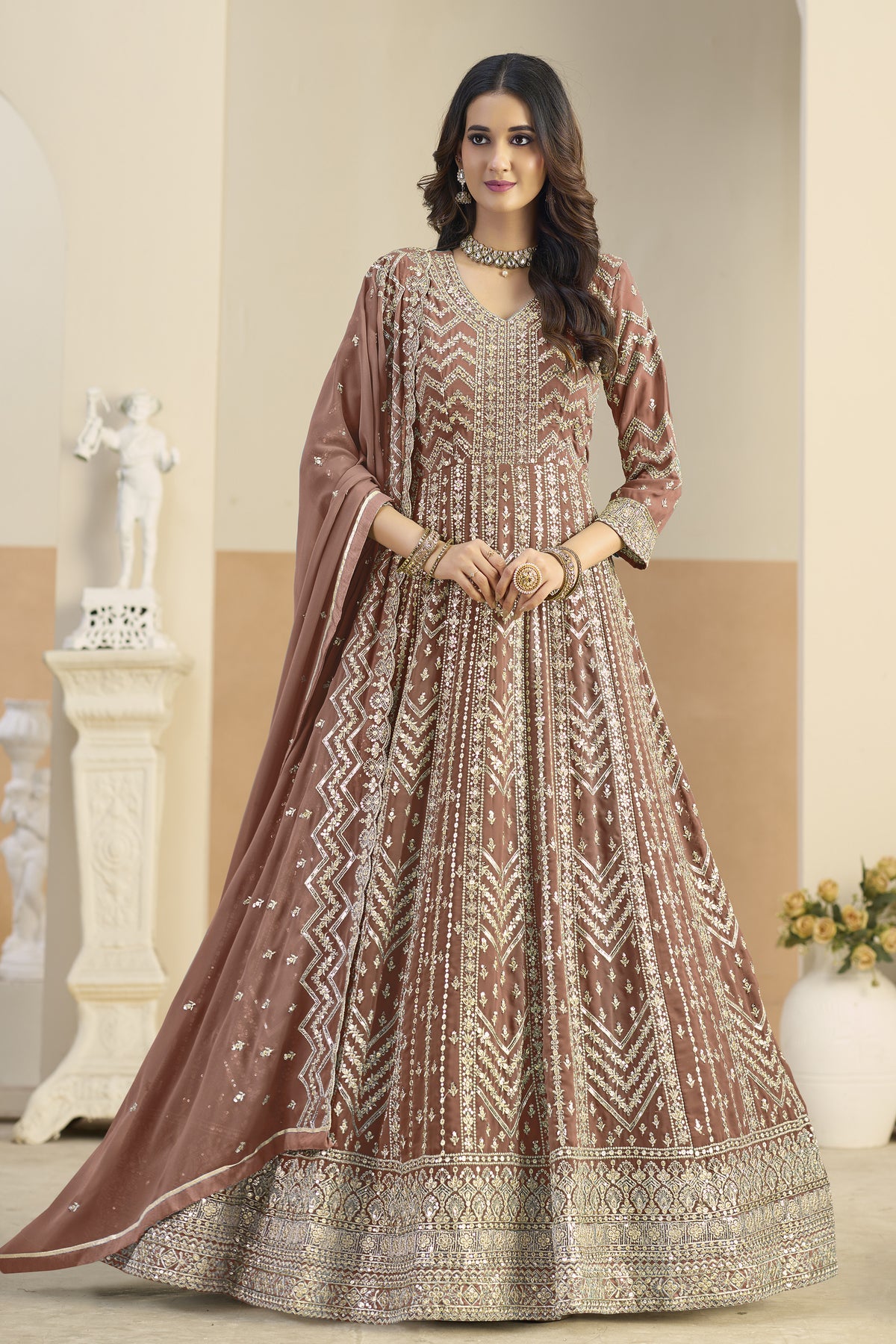 Light brown anarkali salwar suit with heavy embroidery, front view