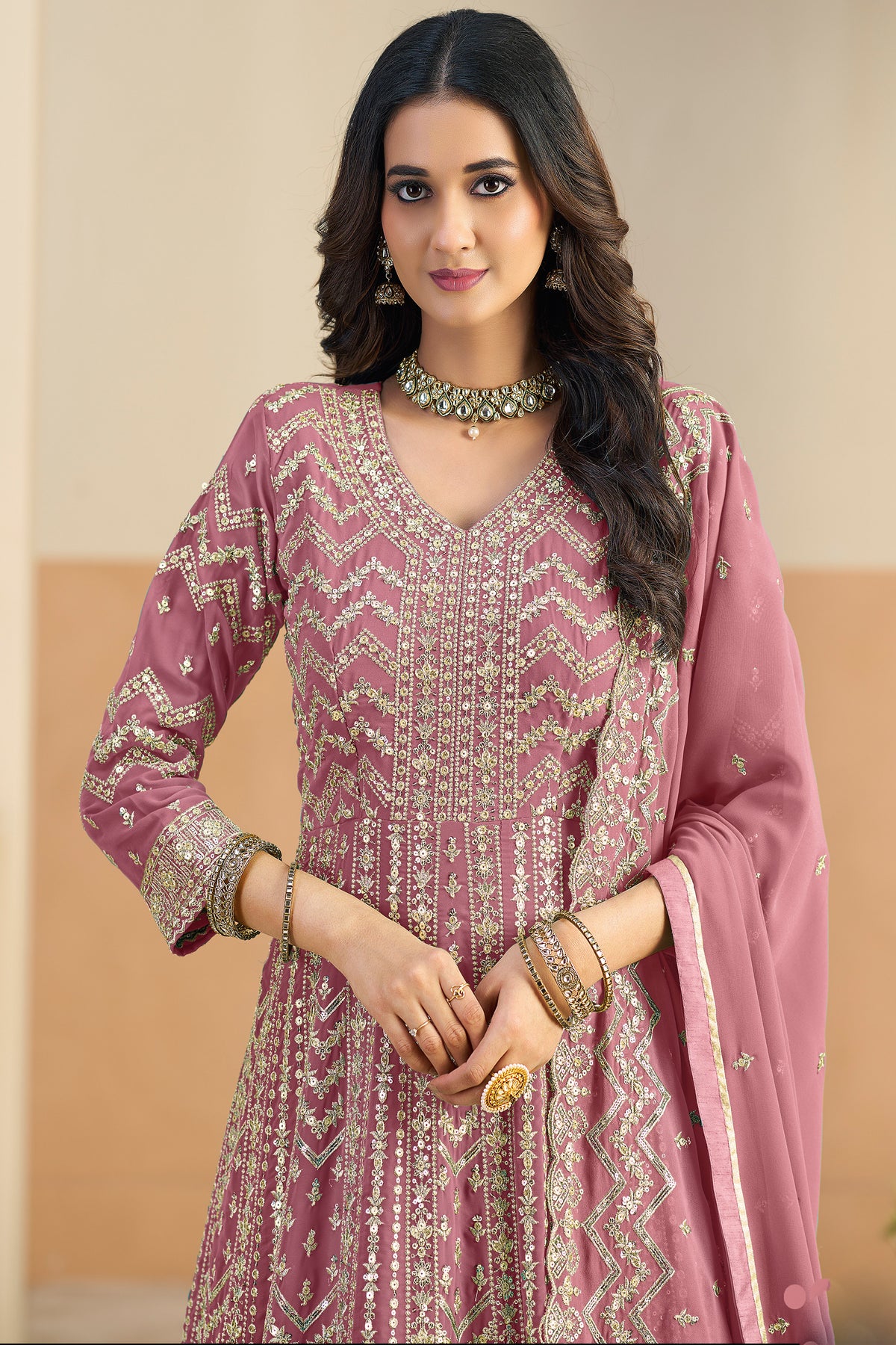 Close-up of embroidery work on pink anarkali dupatta dress neckline