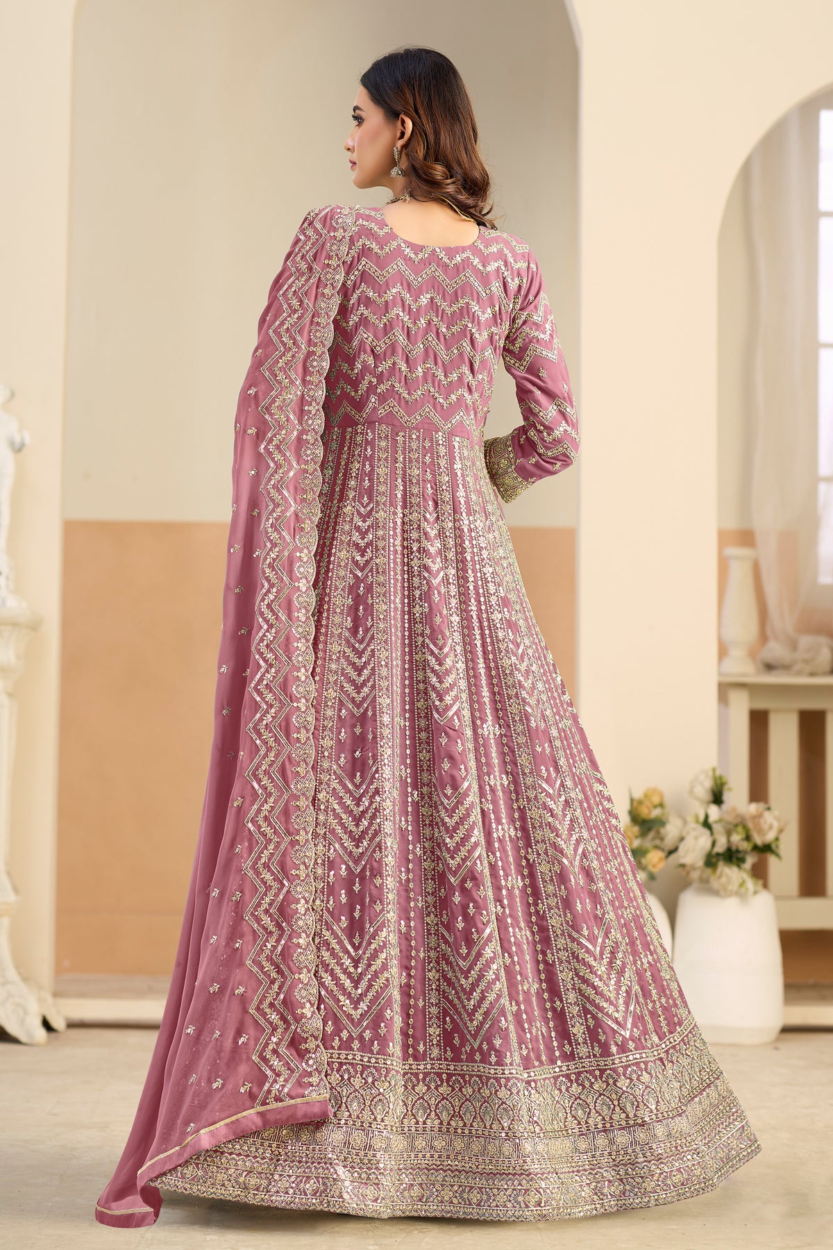 Back view of pink anarkali gown with embroidered hemline