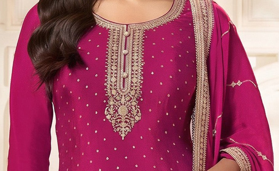 Sequence and coding embroidery close-up on pink kameez neckline