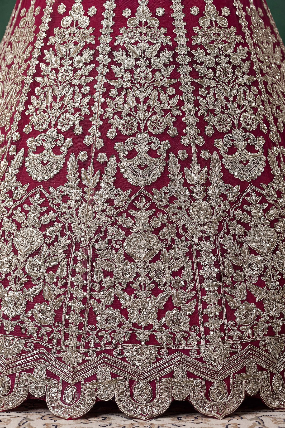 Close-up of Soft Net fabric on pink lehenga set