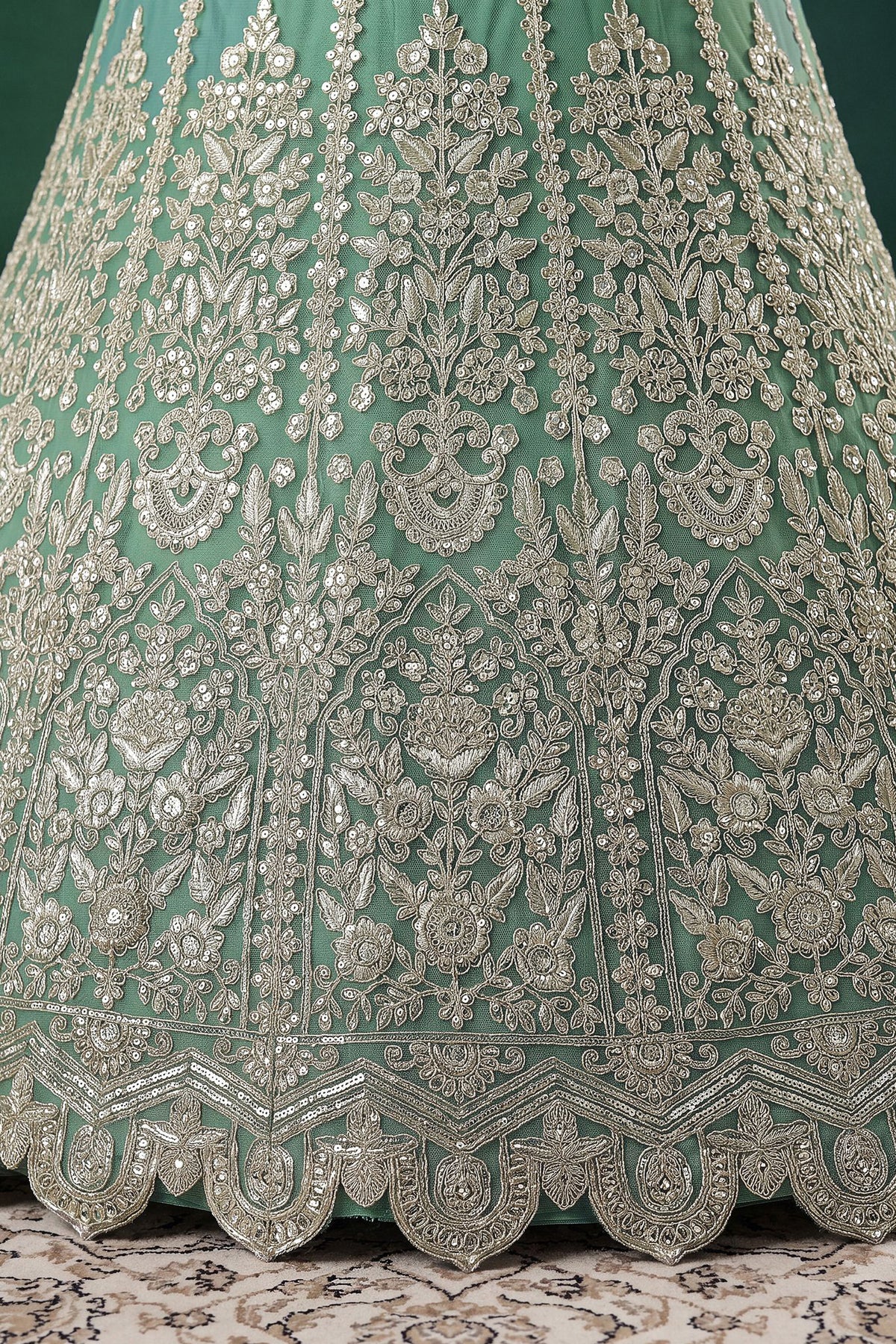 Embroidered lehenga hem detail in pistachio green