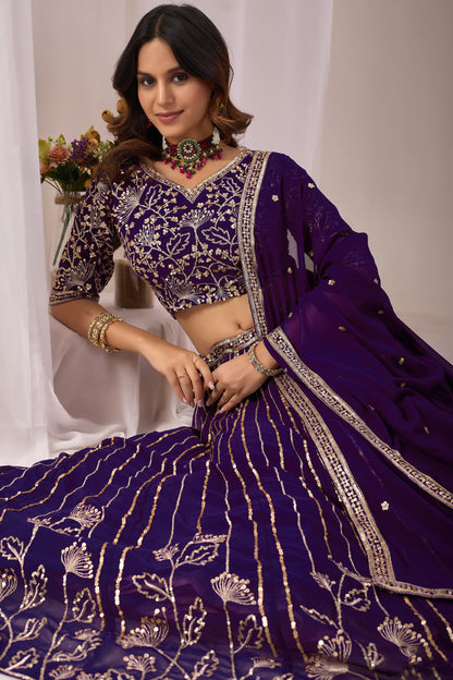 Close-up of embroidery work on the purple lehenga