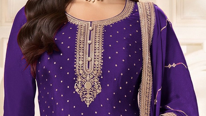 Sequence and coding embroidery close-up on purple kameez neckline