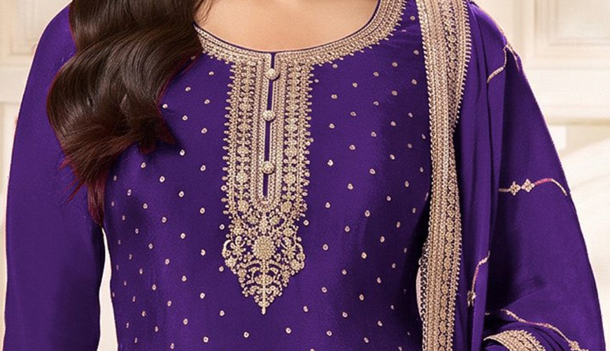 Coding embroidery close-up on purple palazzo suit neckline