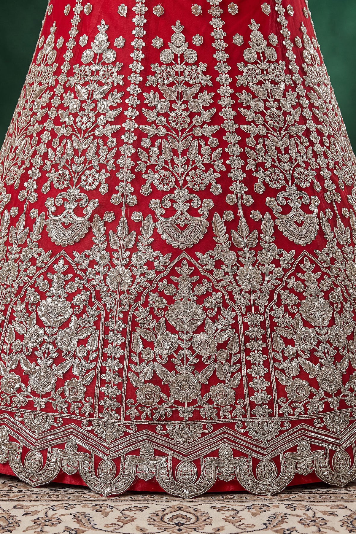 Zari and dori embroidery detail on red lehenga