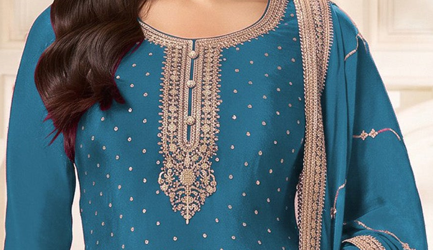 Coding and sequence embroidery close-up on sky blue neckline
