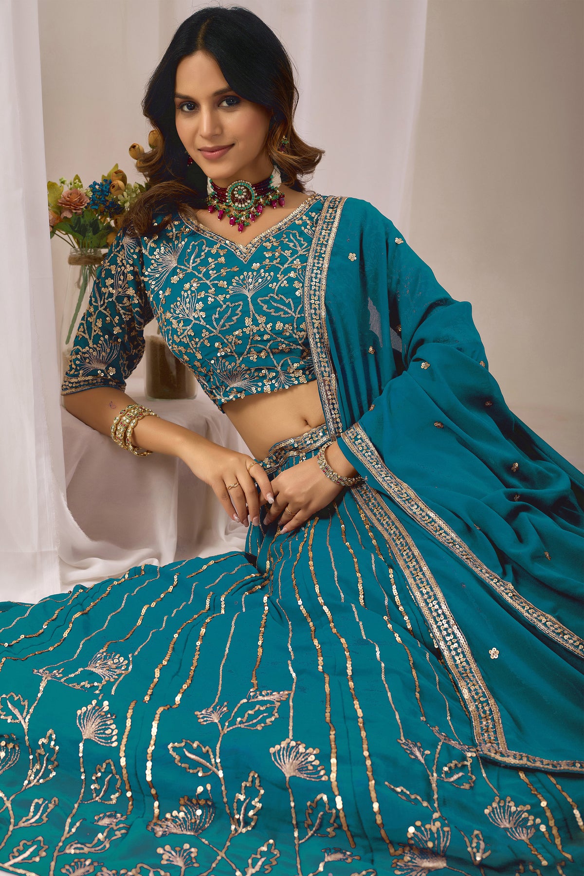 Close-up of heavy embroidery and sequin work on the lehenga.