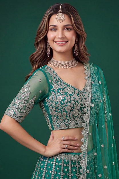 Close-up of zari dori and sequence embroidery on teal blue blouse