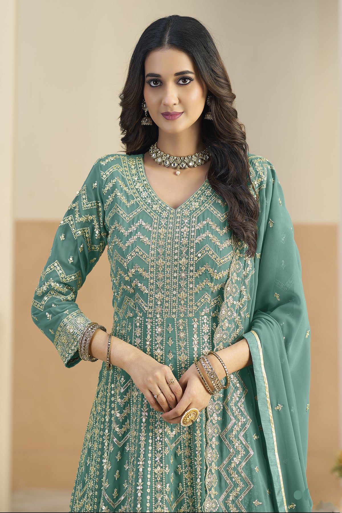 Close-up of embroidery work on teal green anarkali dupatta dress neckline
