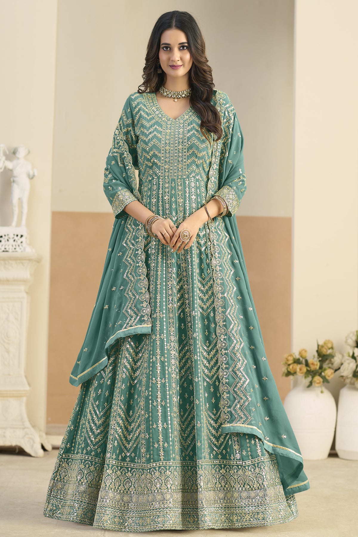 Sleeve embroidery detail on teal green anarkali gown