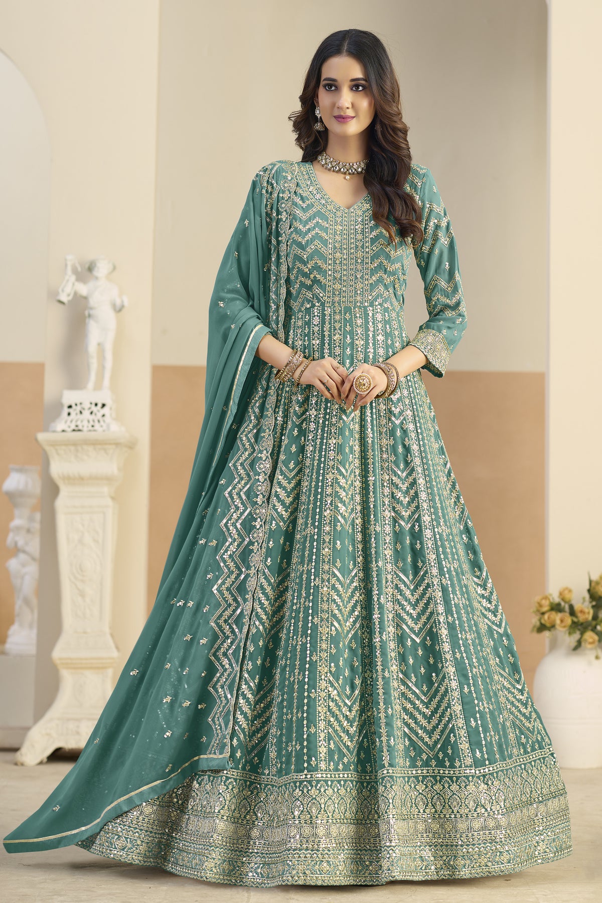 Teal green anarkali salwar suit with heavy embroidery, front view